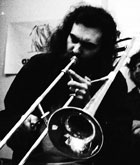 Jeffrey Steele artist playing trombone in Portsmouth Sinfonia 1970s